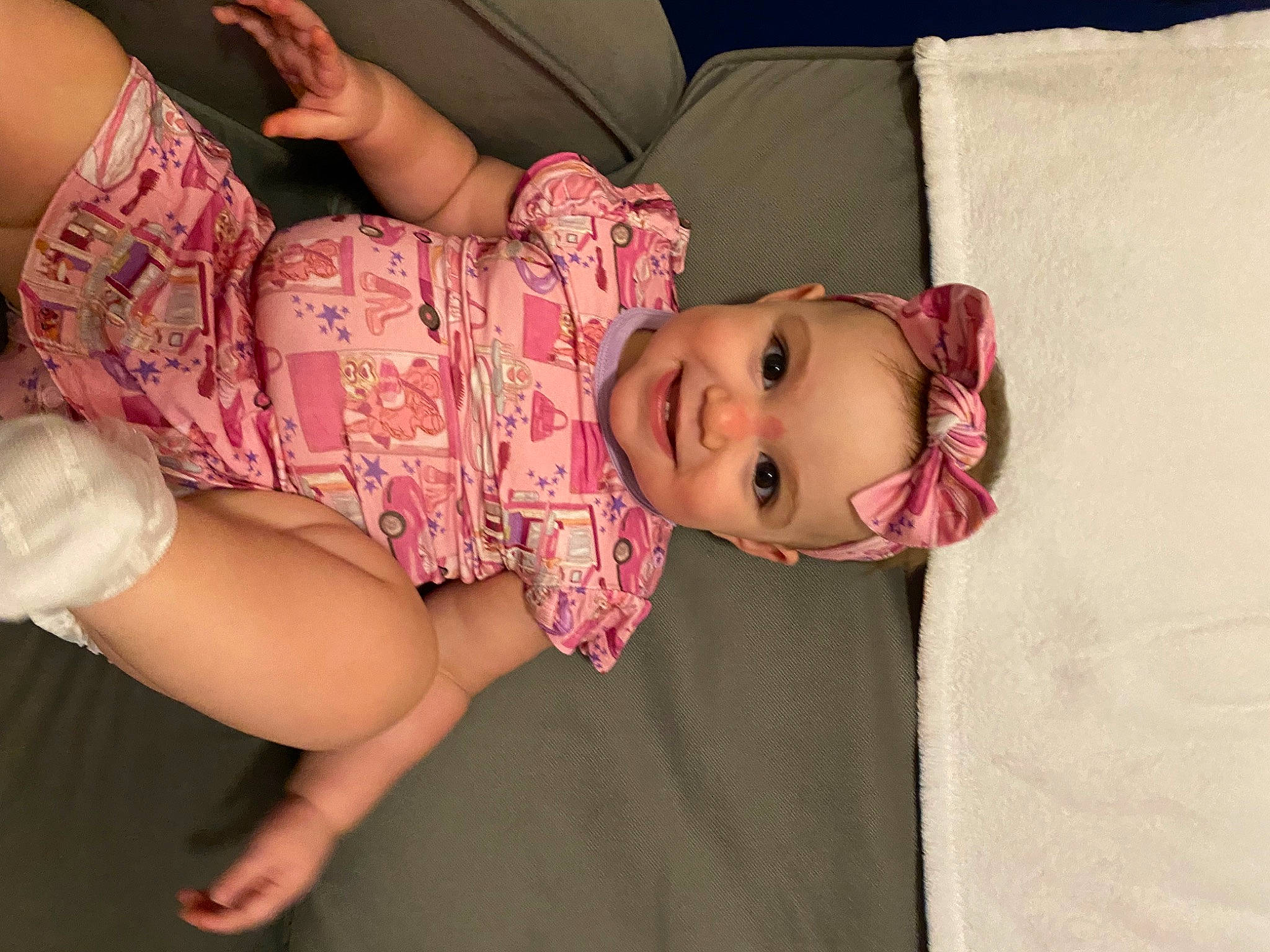 Lucy is registered to the contest to win money with this photo: baby_toddler_clothing, cheek, comfort, eye, eyelash, glasses, hand, headgear, headwear, human_body, joint, joy, leg, lip, mouth, neck, person, pink, product, skin