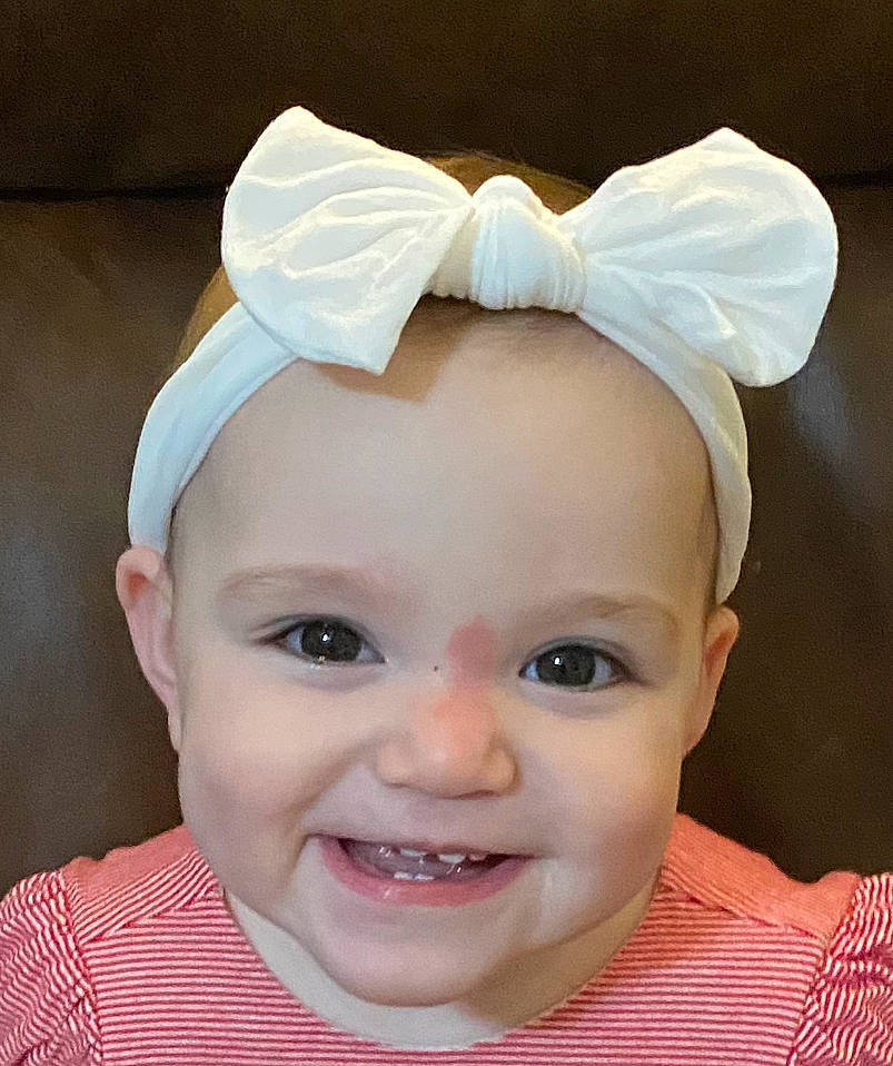 Lucy joined the competition — help win amazing prizes! baby, baby_toddler_clothing, cheek, child, clothing, ear, eyebrow, eyelash, face, fashion_accessory, hair_accessory, happy, headband, headpiece, iris, joy, nose, person, pink, skin