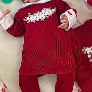Aurora is registered to the contest to win money with this photo: newborn, baby, sleeping, infant, portrait, red_dress, headband, bow, floral_embroidery, white_collar, crib, bedding, pacifier, butterflies, nursery, indoors, peaceful, cute, child, textile