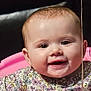 baby, child, smiling, face, portrait, floral_clothing, pink_chair, happy, cute, infant, young_child, skin, head, eyelashes, mouth, person, seated, indoors, expression, cheerful