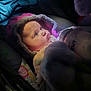Vyolette is registered to the contest to win money with this photo: baby, bottle, blanket, child, clothing, face, fur, hood, infant, light, looking, person, portrait, soft, toy, warm, wrapped, young, feeding, carseat