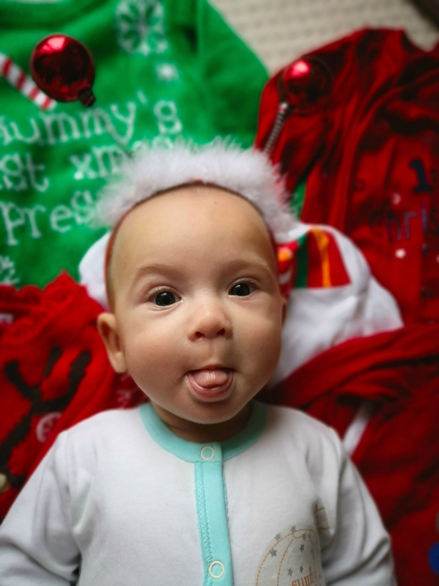 Sasha is registered to the contest to win money with this photo: baby, cheek, child, christmas, christmas_eve, fictional_character, head, holiday, person, smile, toddler
