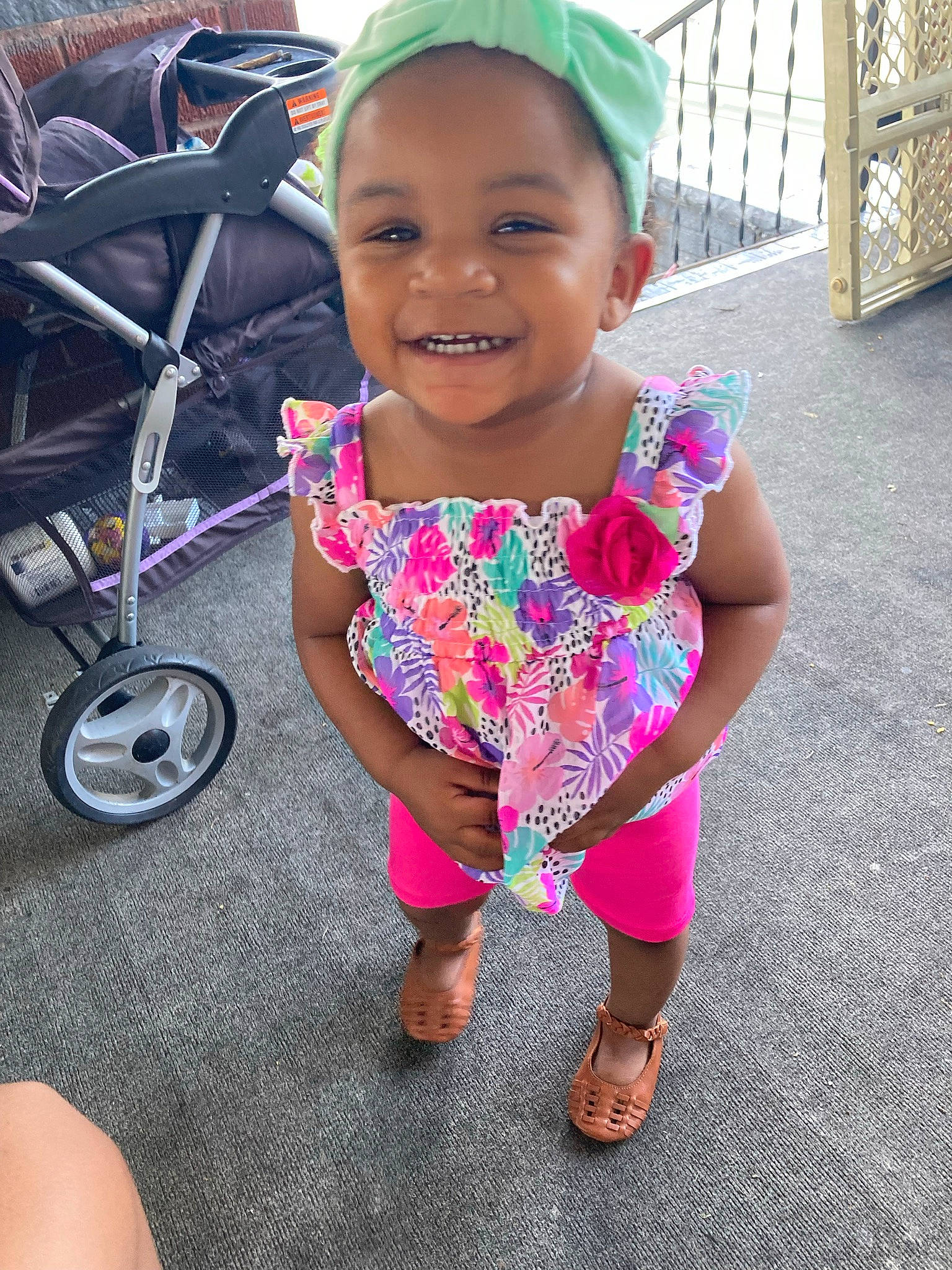 Tevana is registered to the contest to win money with this photo: automotive_tire, baby_toddler_clothing, bicycle_tire, bicycle_wheel, child, cool, eye, face, fun, happy, joy, magenta, person, pink, rim, skin, sleeve, smile, snapshot, tire