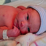 Emery joined the competition — help win amazing prizes! newborn, baby, infant, hospital, blanket, hat, wristband, closeup, face, skin, lying, young, cute, sleepy, hospital_bed, soft, resting, headwear, person, newborn_baby