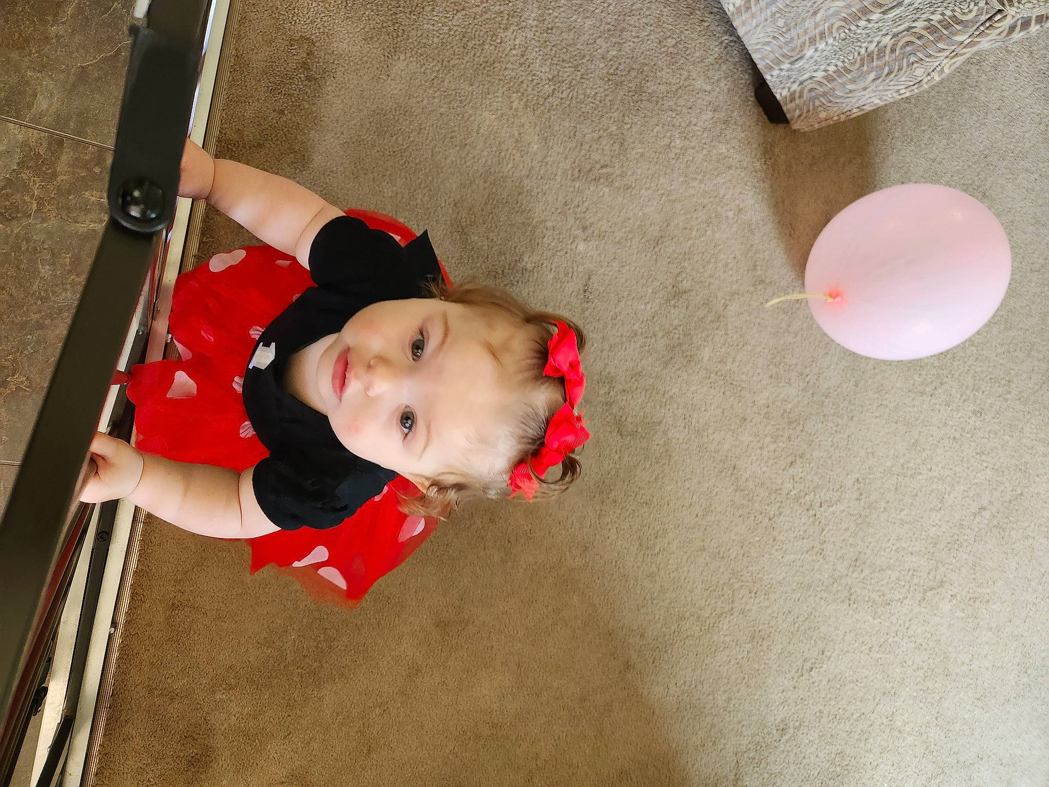 Grayce is registered to the contest to win money with this photo: baby, baby_carriage, baby_products, baby_toddler_clothing, carmine, child, flooring, fun, human_body, human_leg, person, play, skin, toddler, wood