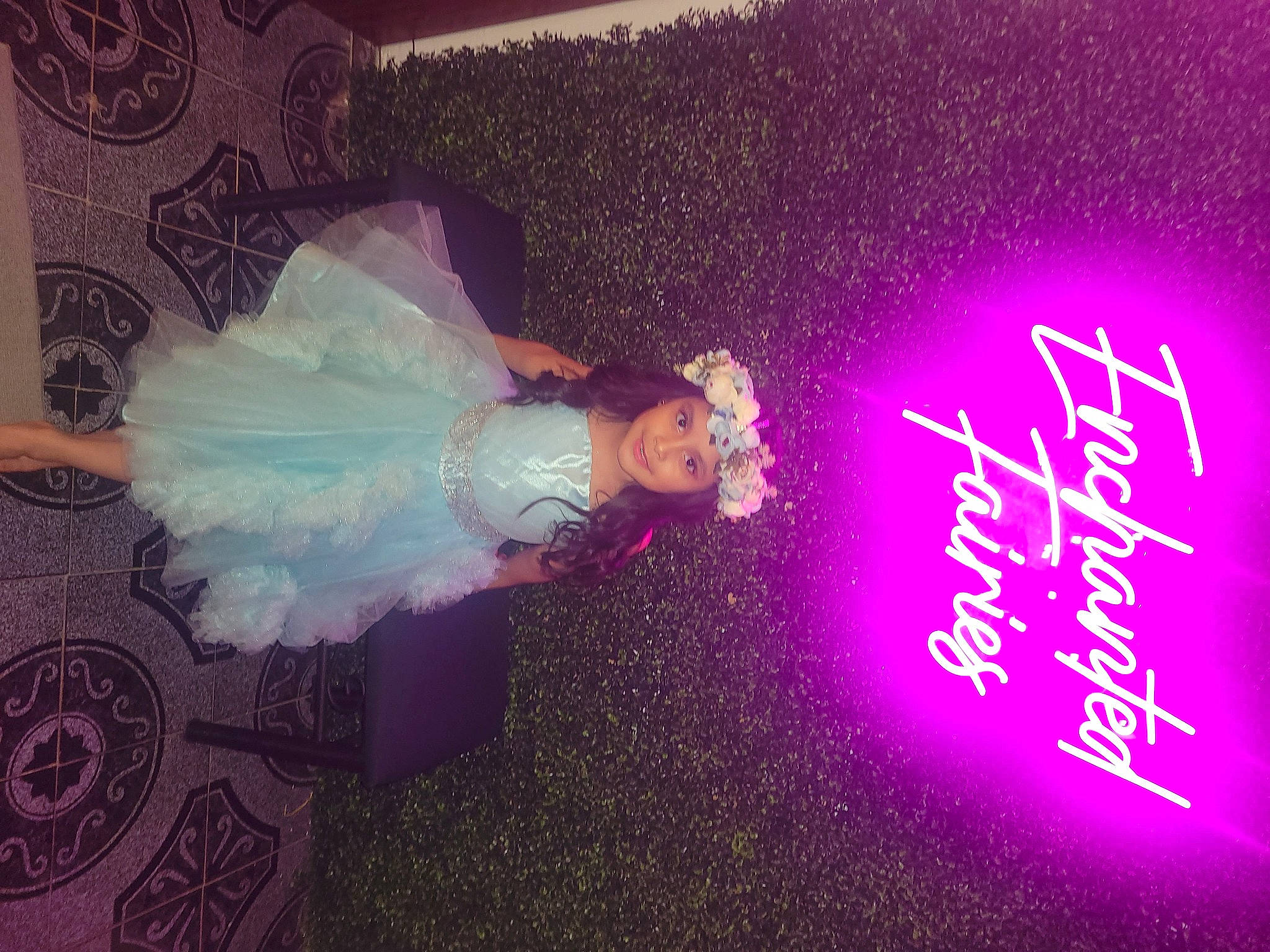 Sofia Guzman joined the competition — help win amazing prizes! bridal_accessory, curtain, dress, electric_blue, electronic_signage, event, flooring, font, fun, graphics, happy, headwear, joy, magenta, neon, person, pink, purple, room, signage