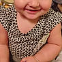 Helena is registered to the contest to win money with this photo: toddler, child, smile, headband, bow, heart_pattern, clothing, pacifier, hand, foot, face, indoors, sitting, baby, cute, person, skin, toy, happy, casual