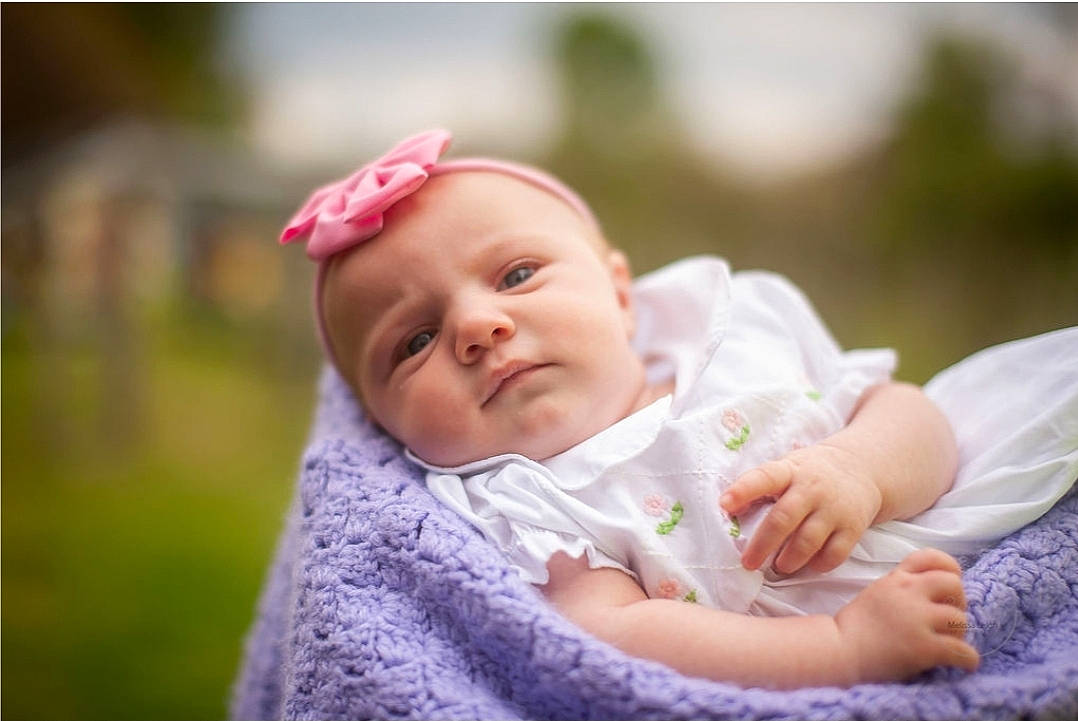 Lakelyn joined the competition — help win amazing prizes! baby, baby_toddler_clothing, cap, cheek, comfort, dress, face, fashion_accessory, flash_photography, grass, happy, hat, headgear, lip, people_in_nature, person, pink, plant, sitting, skin