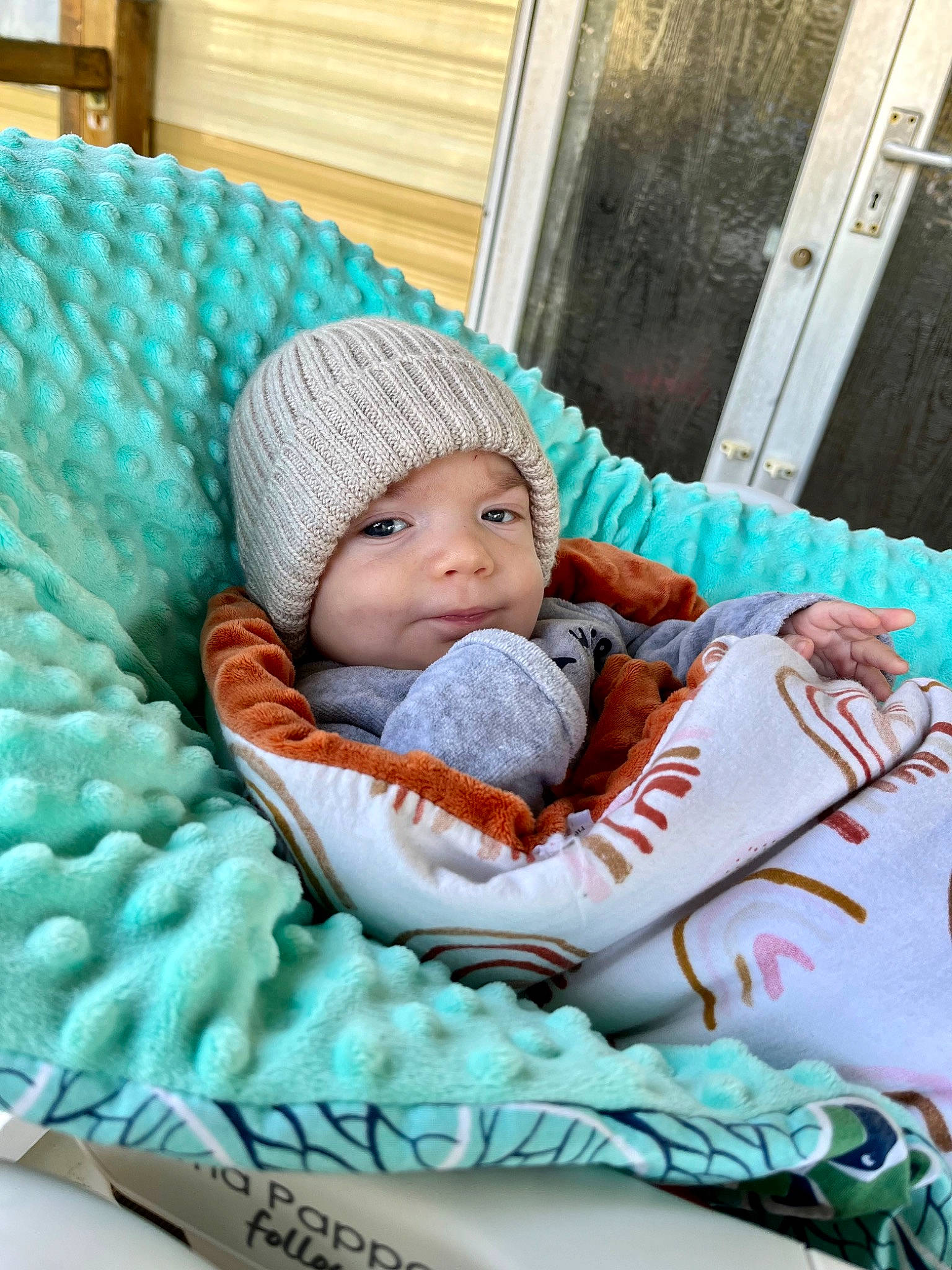 Andrew participe au concours pour gagner de l'argent avec cette photo : baby, baby_products, baby_sleeping, baby_toddler_clothing, cap, cheek, child, comfort, couch, door, face, grass, headgear, headwear, knit_cap, linens, person, sitting, textile, toddler