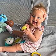 Jessaleena joined the competition — help win amazing prizes! baby, child, smiling, playpen, toy, doll, yellow_ball, pink_outfit, headband, flower, mesh, fabric, blue_toy, red_toy, sitting, happy, cute, indoor, play, infant