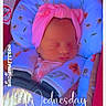 newborn, baby, sleeping, car_seat, pink_headband, pacifier, floral_pattern, blanket, child, infant, closeup, indoors, safety_harness, cute, peaceful, portrait, soft_lighting, colorful, text_overlay, resting