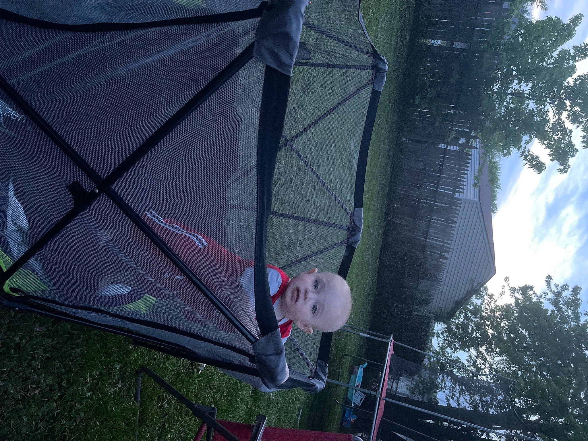 Gavyn is registered to the contest to win money with this photo: automotive_exterior, automotive_wheel_system, building, glass, grass, leisure, mesh, person, plant, recreation, shade, sky, tarpaulin, tent, tints_and_shades, tree, triangle, vehicle_door, water, wheel