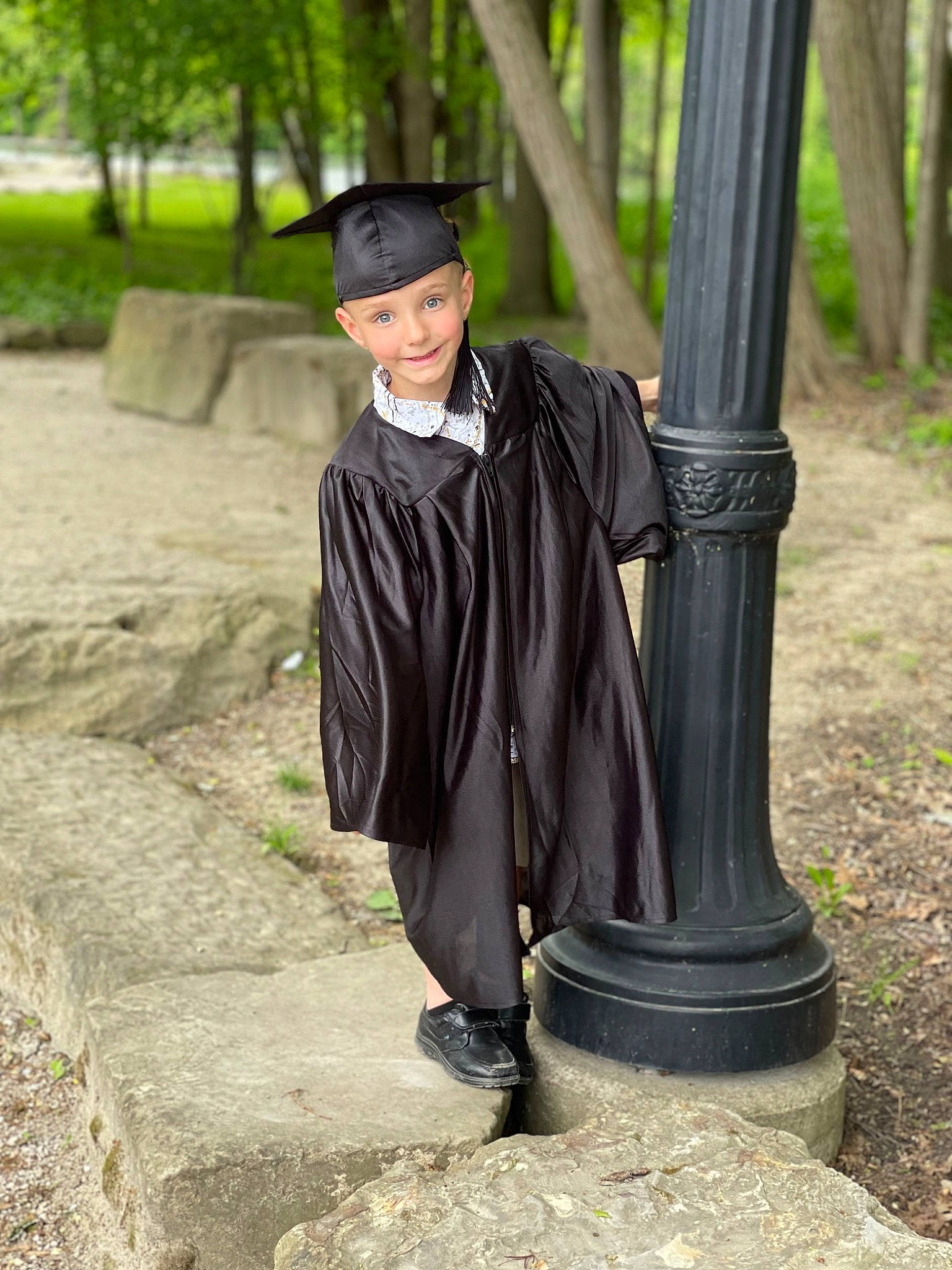 Lyam is registered to the contest to win money with this photo: academic_dress, botany, cloak, event, eye, formal_wear, fun, grass, hat, headwear, joy, leaf, leisure, mortarboard, person, plant, recreation, scholar, sleeve, smile