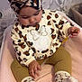Jade participe au concours pour gagner de l'argent avec cette photo : toddler, child, baby, sitting, leopard_print, turban, sweater, minnie_mouse, patterned_clothing, socks, blanket, indoor, decorations, paper_flowers, butterflies, cute, soft_lighting, portrait, curious, handheld_object