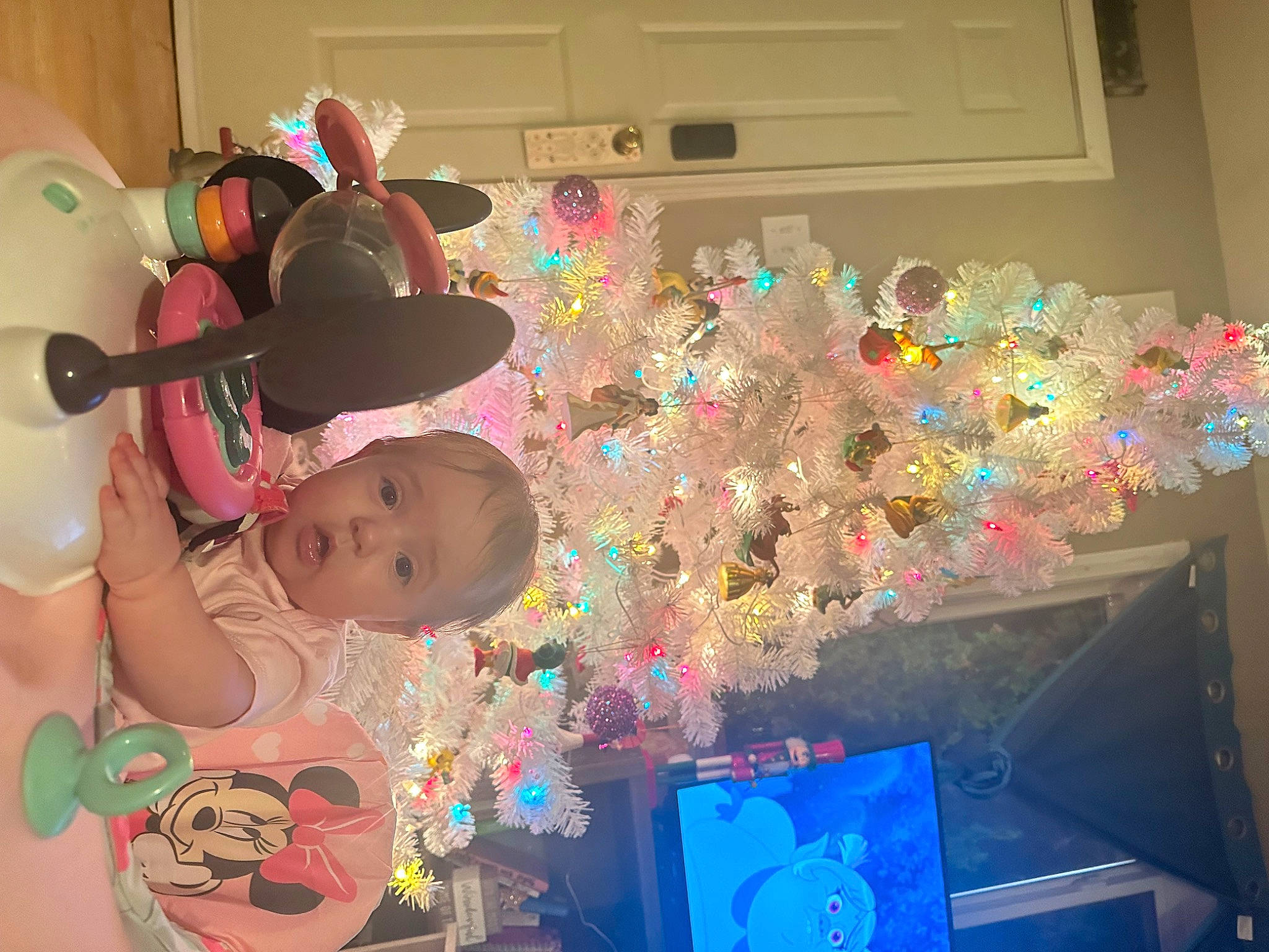 Sofia is registered to the contest to win money with this photo: baby, baby_toddler_clothing, baby_toys, child, christmas_tree, event, fun, hat, holiday, ornament, party, party_supply, person, pink, play, room, space, surprise, toddler, toy