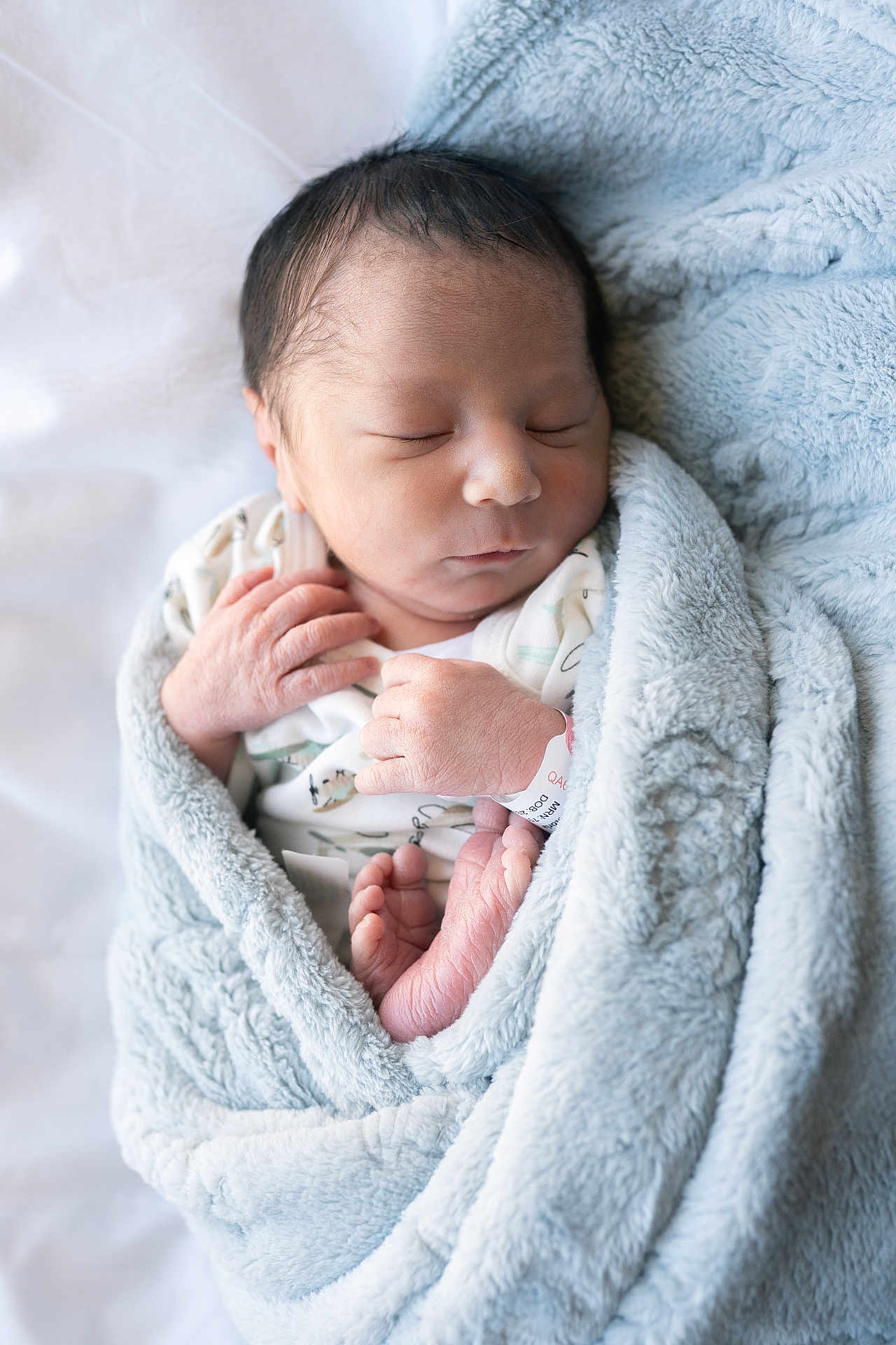Elijah is registered to the contest to win money with this photo: newborn, baby, sleeping, blanket, blue, infant, soft, wrapped, peaceful, hands, feet, cute, cozy, portrait, child, indoors, closeup, skin, resting, toddler