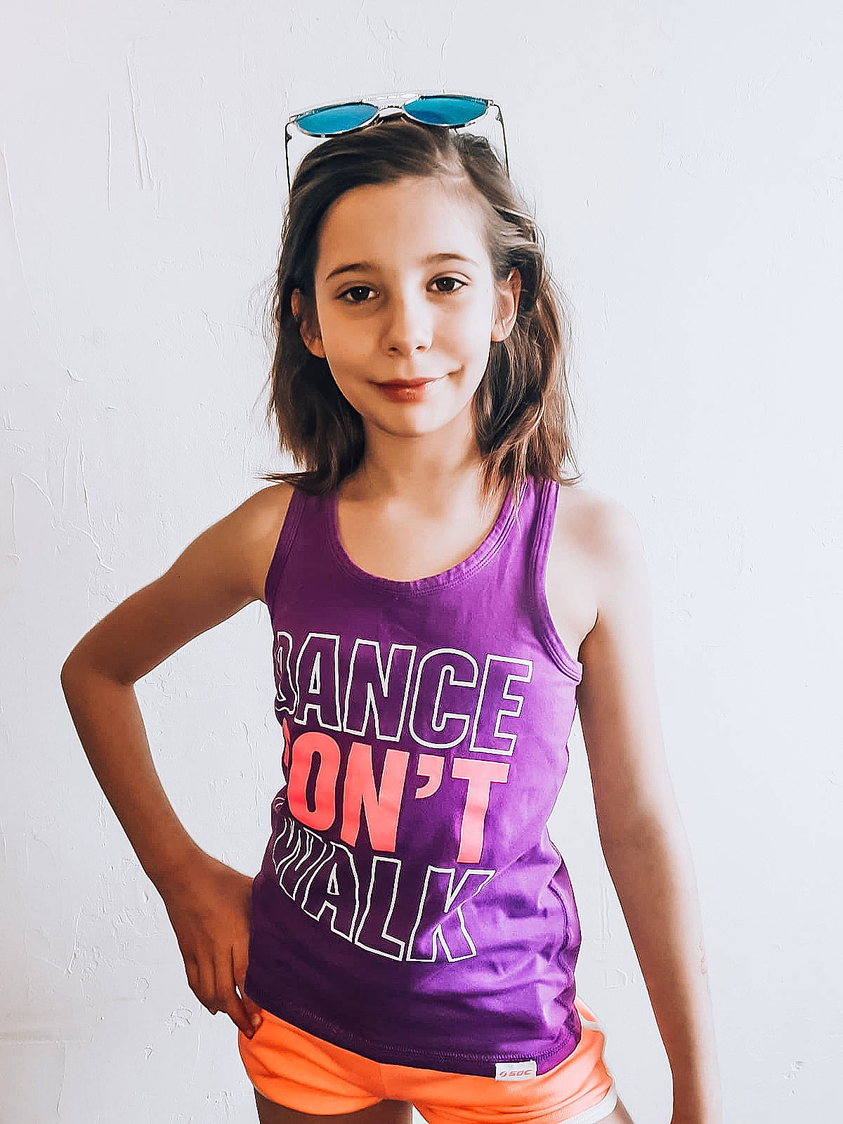 Melinda participe au concours pour gagner de l'argent avec cette photo : abdomen, active_tank, child_model, clothing, joy, model, muscle, neck, person, photo_shoot, photography, pink, purple, sleeve, sleeveless_shirt, stomach, t_shirt, top, waist