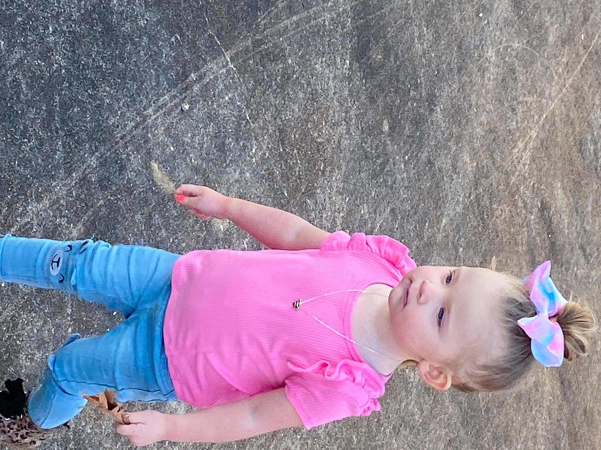 Journey is registered to the contest to win money with this photo: arm, baby, child, electric_blue, fun, grass, happy, human_leg, joint, leisure, magenta, people_in_nature, person, pink, play, recreation, sleeve, thigh, toddler, water