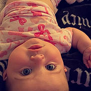 Octavia joined the competition — help win amazing prizes! baby, infant, child, face, eyes, blanket, clothing, pink, pattern, lying_down, cute, adorable, expression, skin, head, mouth, hand, soft, cozy, indoor