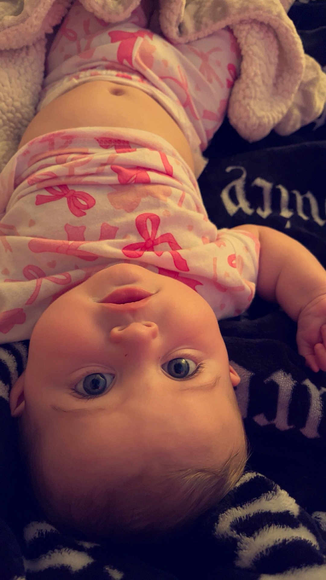 Octavia joined the competition — help win amazing prizes! baby, infant, child, face, eyes, blanket, clothing, pink, pattern, lying_down, cute, adorable, expression, skin, head, mouth, hand, soft, cozy, indoor