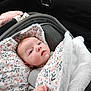 baby, blanket, blue_eyes, car_seat, child, clothing, comfort, cozy, cute, face, floral_pattern, hand, head, indoor, infant, newborn, portrait, soft_texture, warm, wrapped