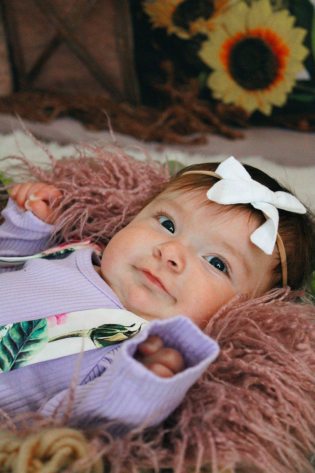 Alivia joined the competition — help win amazing prizes! baby, baby_toddler_clothing, brown_hair, cheek, child, chin, eye, eyelash, flower, fun, grass, happy, head, headband, headwear, lip, person, plant, sitting, skin