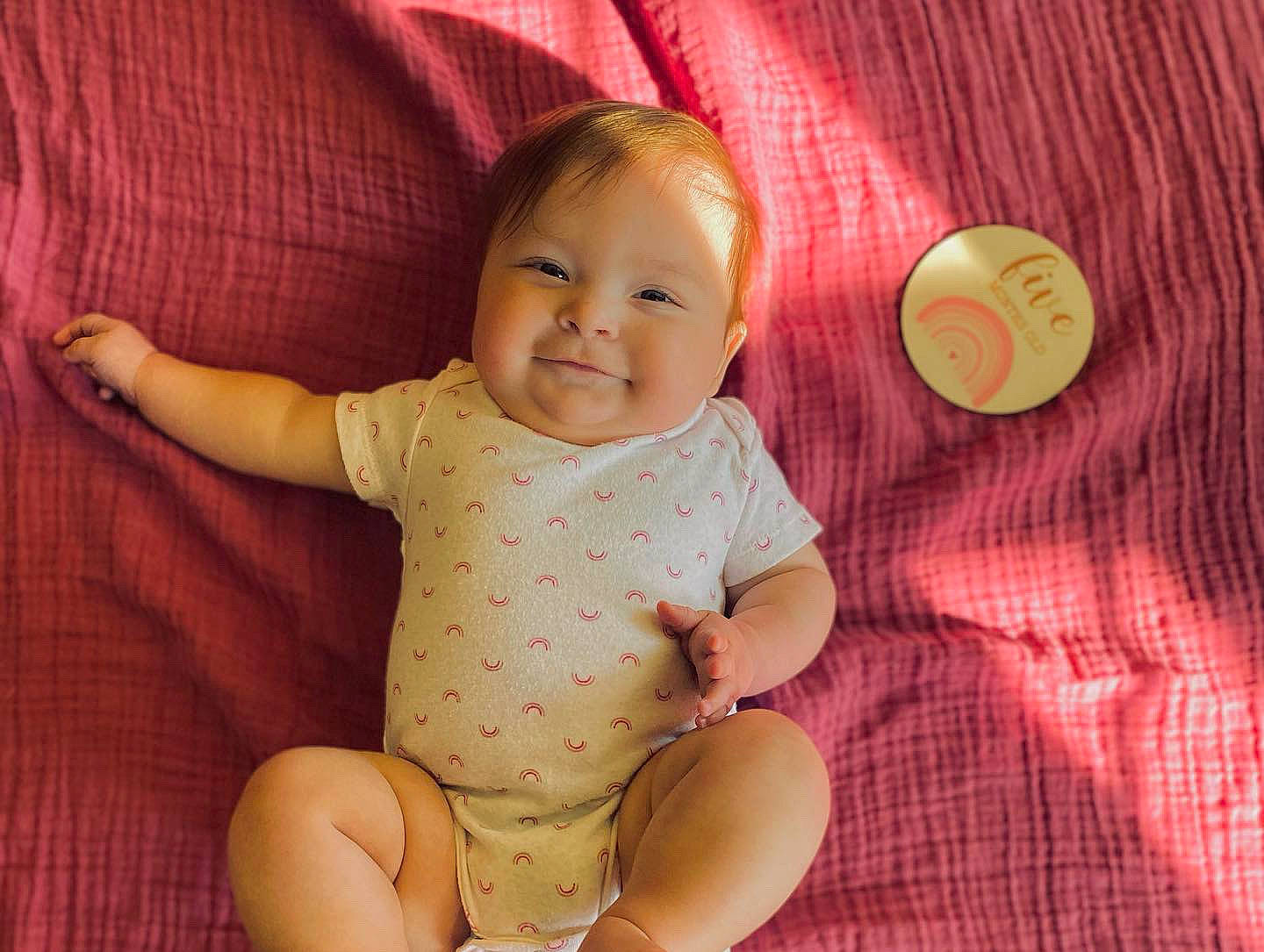 Alivia is registered to the contest to win money with this photo: baby, baby_toddler_clothing, cheek, comfort, face, finger, hand, happy, head, human_body, iris, joy, person, pink, product, red, skin, sleeve, smile, textile