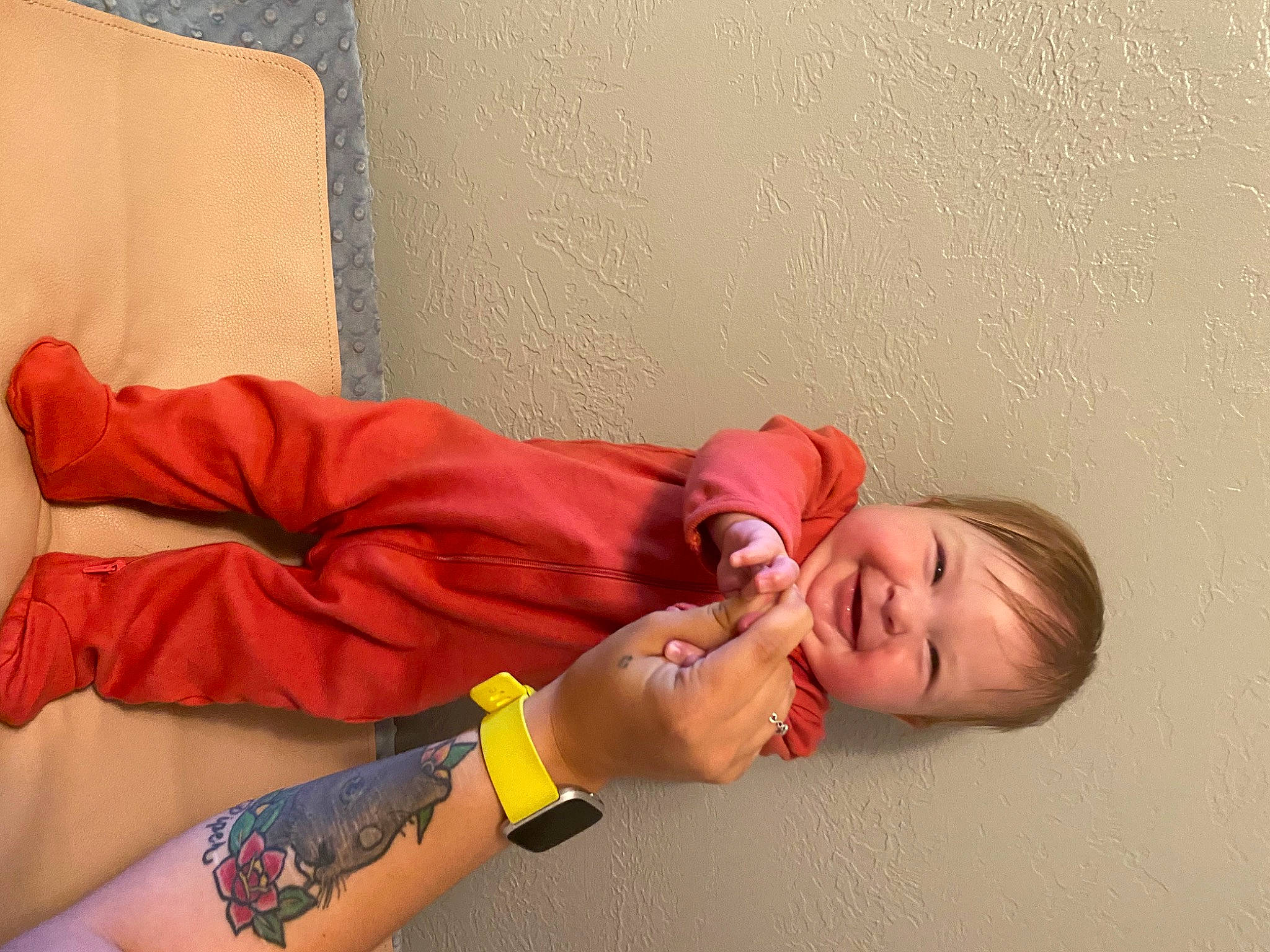 Alivia is registered to the contest to win money with this photo: arm, baby_toddler_clothing, comfort, elbow, finger, floor, flooring, happy, human_leg, joint, joy, knee, linens, neck, person, shoulder, skin, smile, thigh, toddler