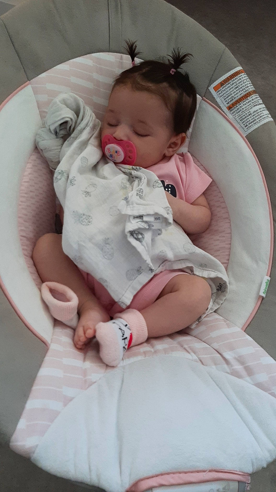 Lindsey participe au concours pour gagner de l'argent avec cette photo : baby, baby_products, baby_sleeping, baby_toddler_clothing, chair, cheek, child, comfort, happy, human_leg, lip, pattern, person, pink, product, sitting, skin, sleeve, sock, thigh