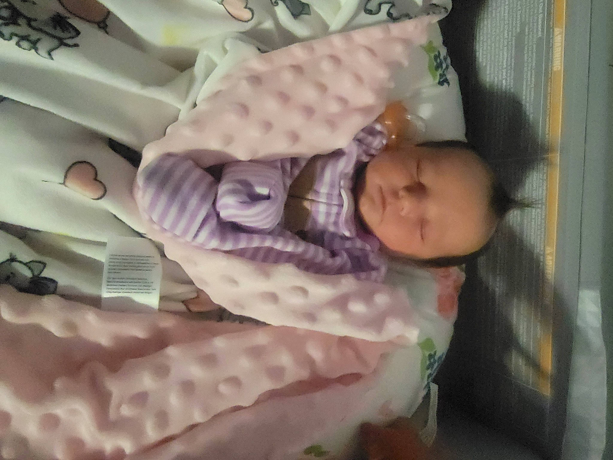 Ariya is registered to the contest to win money with this photo: baby, baby_products, baby_safety, baby_sleeping, baby_toddler_clothing, bedding, bedtime, child, comfort, cradle, human_body, infant_bed, linens, nap, pattern, person, pink, room, sleeve, textile