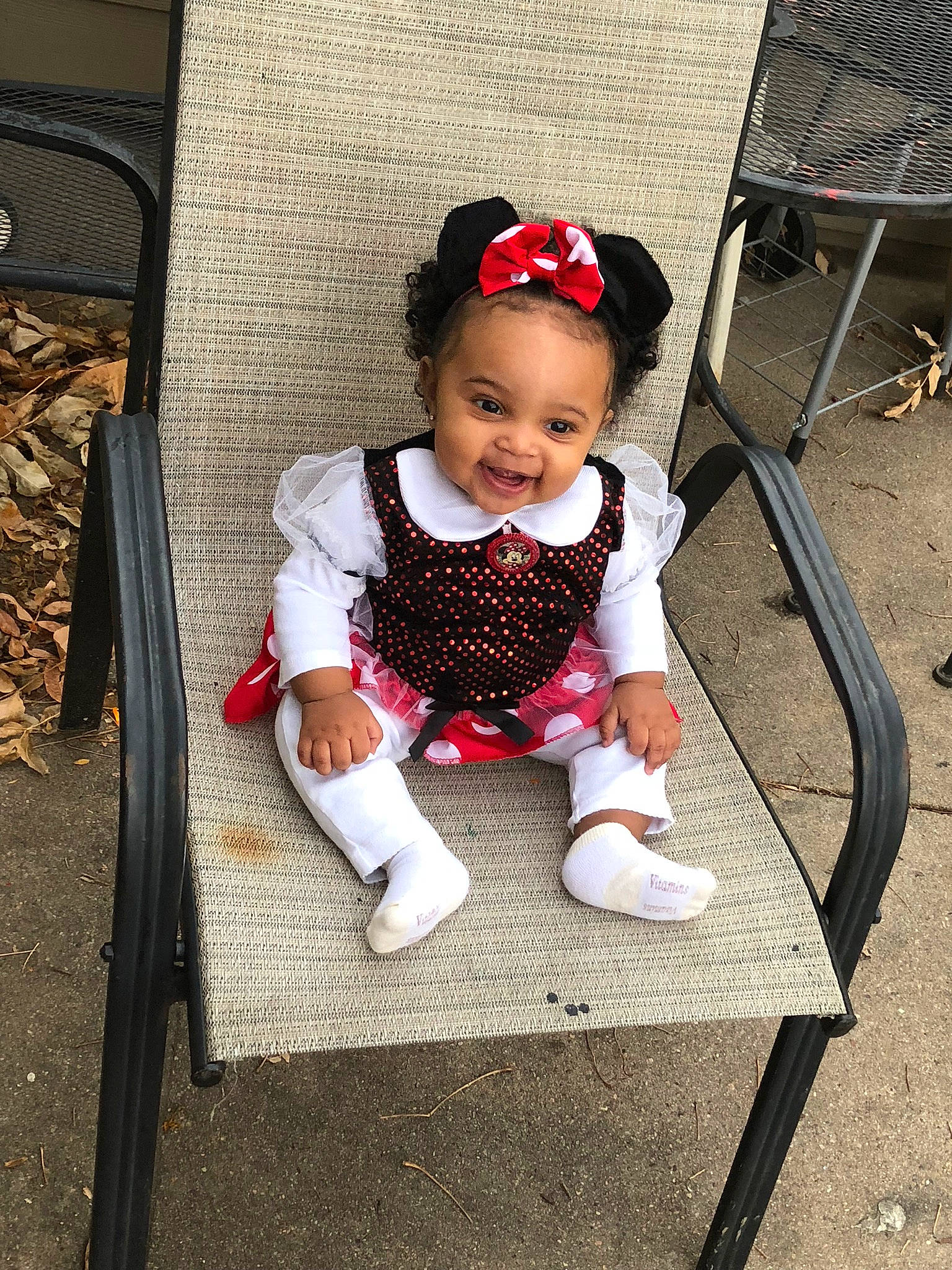 Aubrianna is registered to the contest to win money with this photo: baby, baby_products, baby_toddler_clothing, child, daughter, family, footwear, hair_accessory, head, headband, people, person, play, product, shoe, sitting, skin, smile, toddler