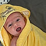 Hudson joined the competition — help win amazing prizes! baby, child, towel, yellow, hood, cute, smile, happy, face, skin, blue_eyes, indoor, blanket, texture, closeup, expression, infant, wrapped, soft, person