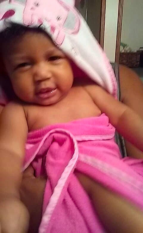 Makiyah is registered to the contest to win money with this photo: arm, beauty, cheek, child, close_up, day, face, finger, girl, hand, head, infant, lip, mouth, nose, person, pink, product, skin, smile