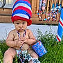 baby, beads, blue, bucket, celebration, child, concrete, decorations, diaper, door, festive, grass, hat, outdoor, patriotic, porch, red, star_shaped_glasses, summer, white