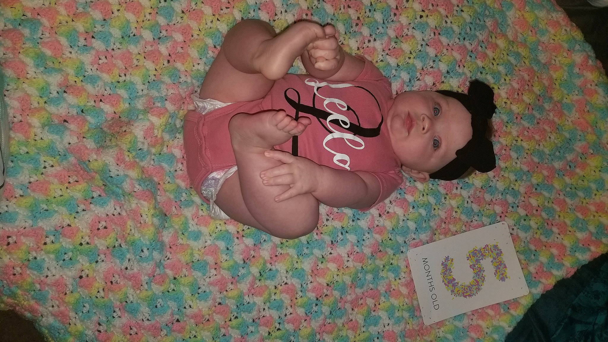 Leela joined the competition — help win amazing prizes! abdomen, baby, baby_toddler_clothing, cheek, chest, comfort, finger, foot, happy, headwear, human_body, human_leg, knee, leg, pattern, person, pink, stomach, textile, thigh