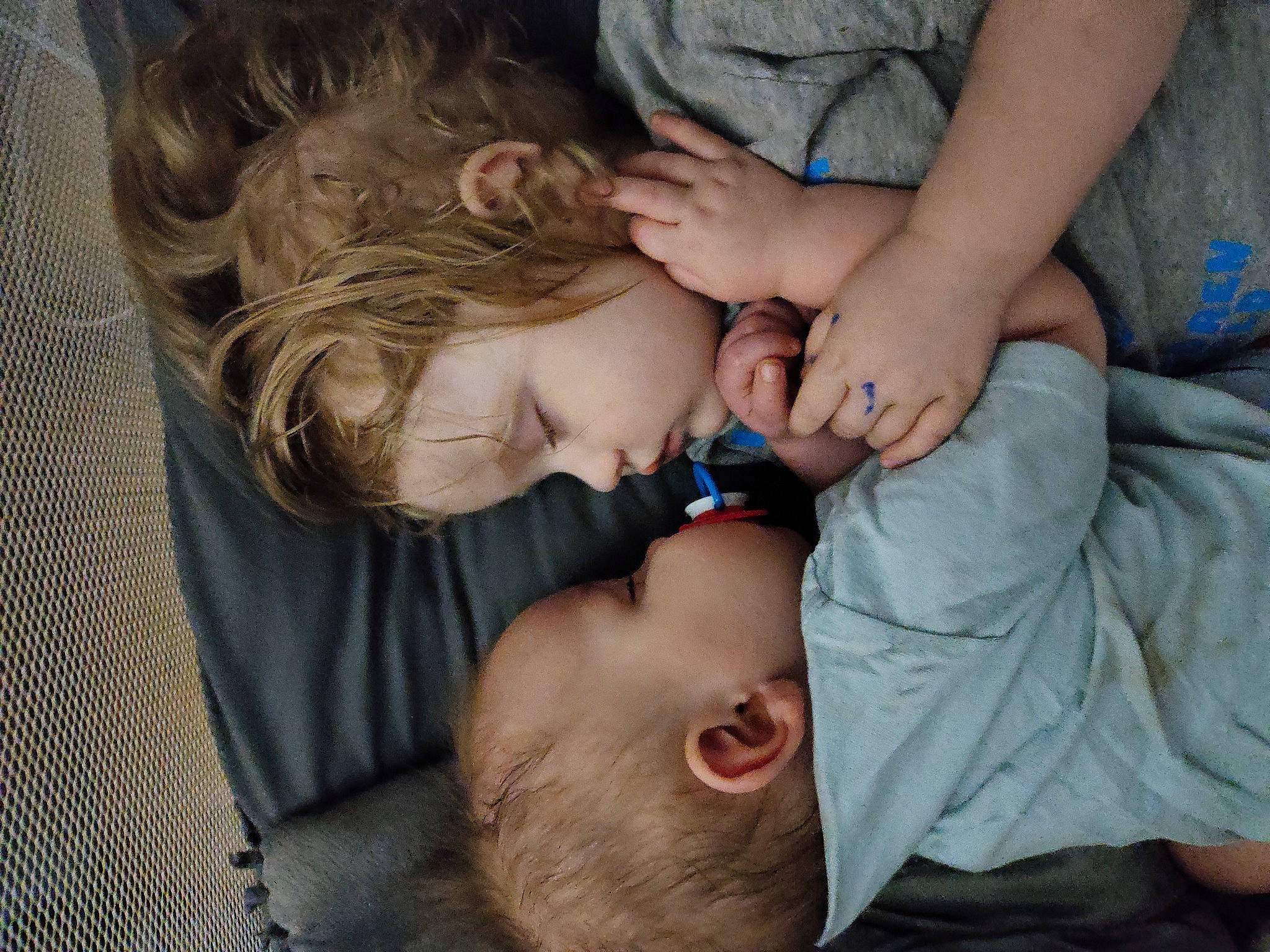 Ryan is registered to the contest to win money with this photo: baby, baby_toddler_clothing, blue, cheek, child, ear, eyelash, finger, gesture, grass, hand, happy, lip, mouth, nose, organ, person, skin, smile, toddler