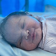 Raqueesha is registered to the contest to win money with this photo: baby, blanket, calm, child, closeup, cute, face, head, hospital, indoors, infant, newborn, peaceful, pink_clothing, portrait, resting, skin, sleeping, soft_texture, young