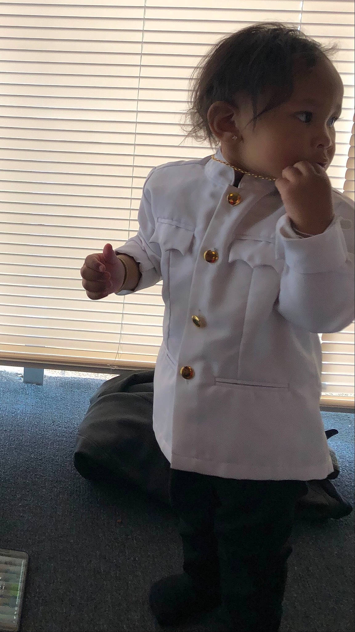 Cedric joined the competition — help win amazing prizes! child, coat, jacket, outerwear, person, sleeve, standing, toddler, top, trench_coat, uniform