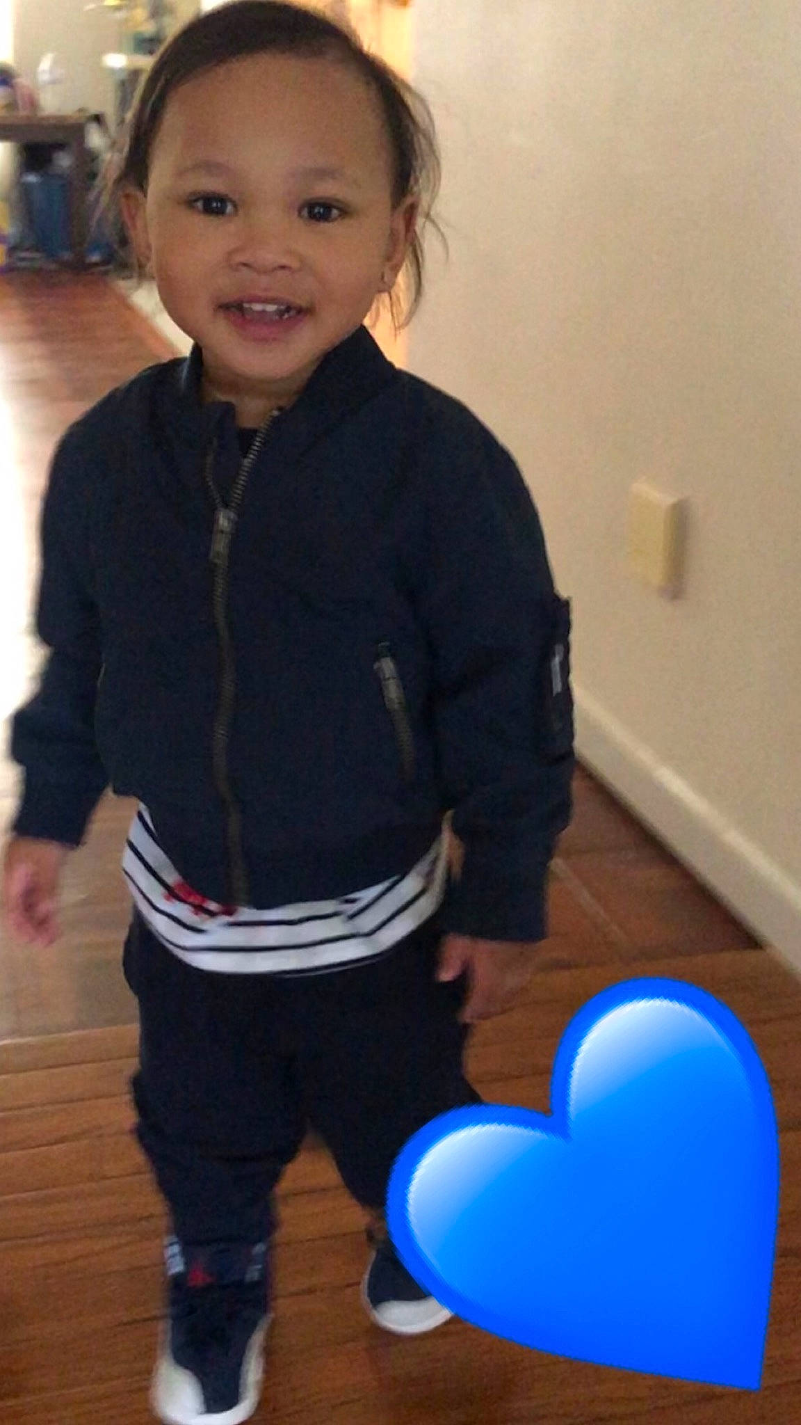 Cedric is registered to the contest to win money with this photo: baby, blue, child, leg, outerwear, person, play, smile, standing, t_shirt, toddler