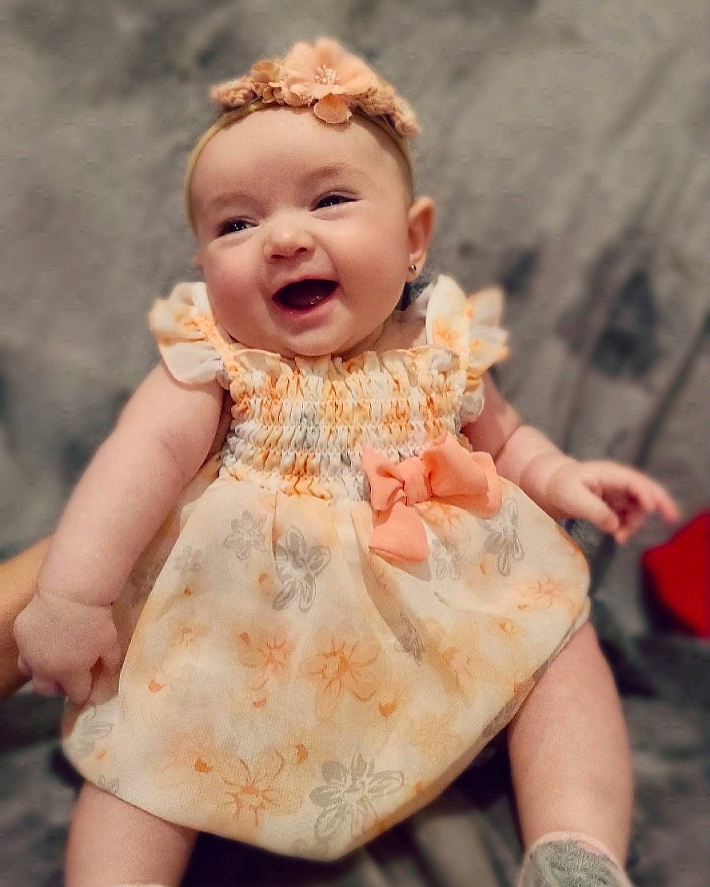 Aubrie is registered to the contest to win money with this photo: baby, baby_toddler_clothing, day_dress, dress, eye, fawn, finger, gesture, hand, happy, headgear, headwear, lip, one_piece_garment, people, person, pink, skin, smile, thumb