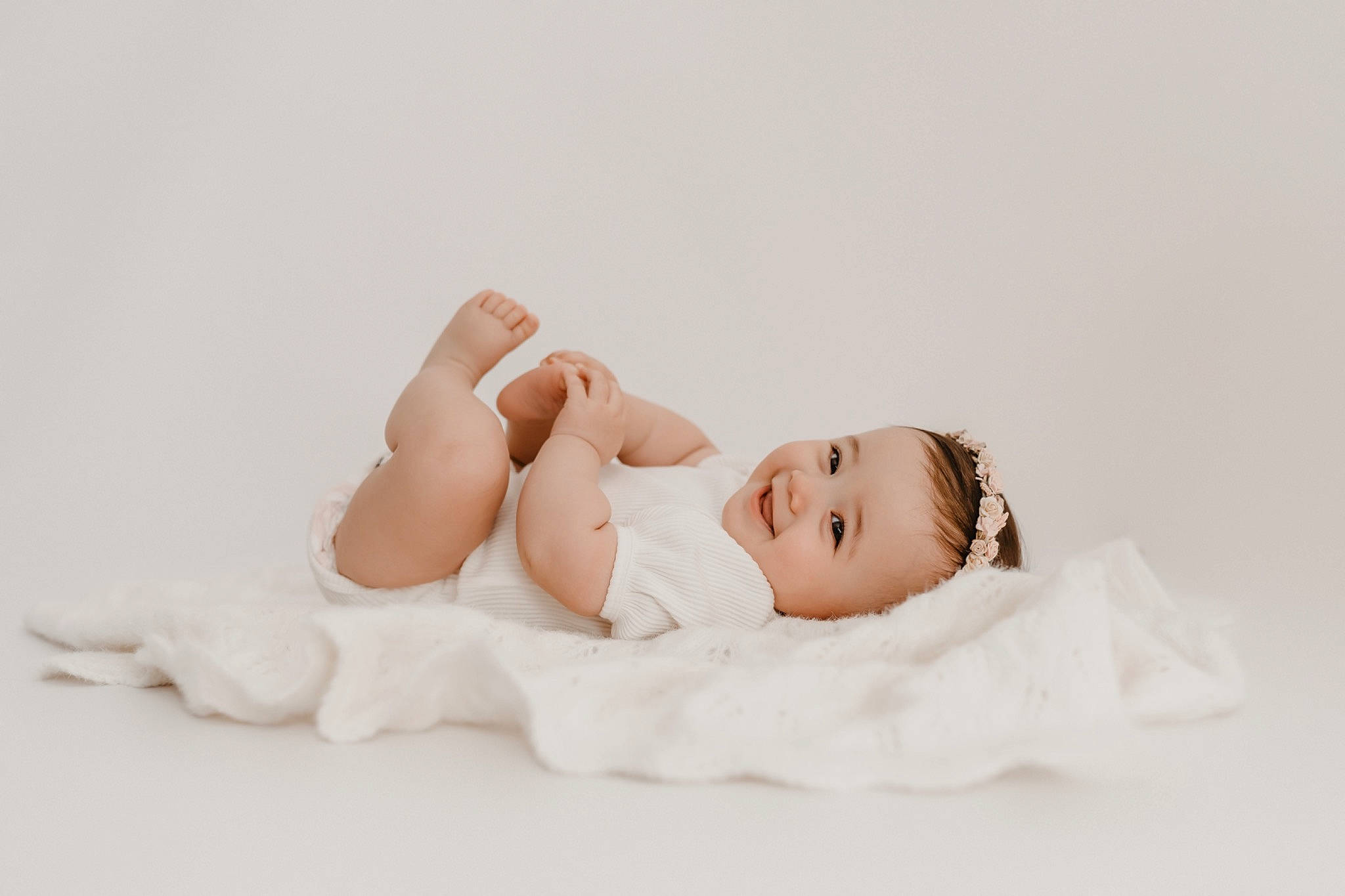 Aleenah is registered to the contest to win money with this photo: baby, barefoot, child, comfort, elbow, eye, flash_photography, flooring, foot, fur, gesture, happy, human_leg, joy, knee, linens, person, portrait_photography, sitting, thigh