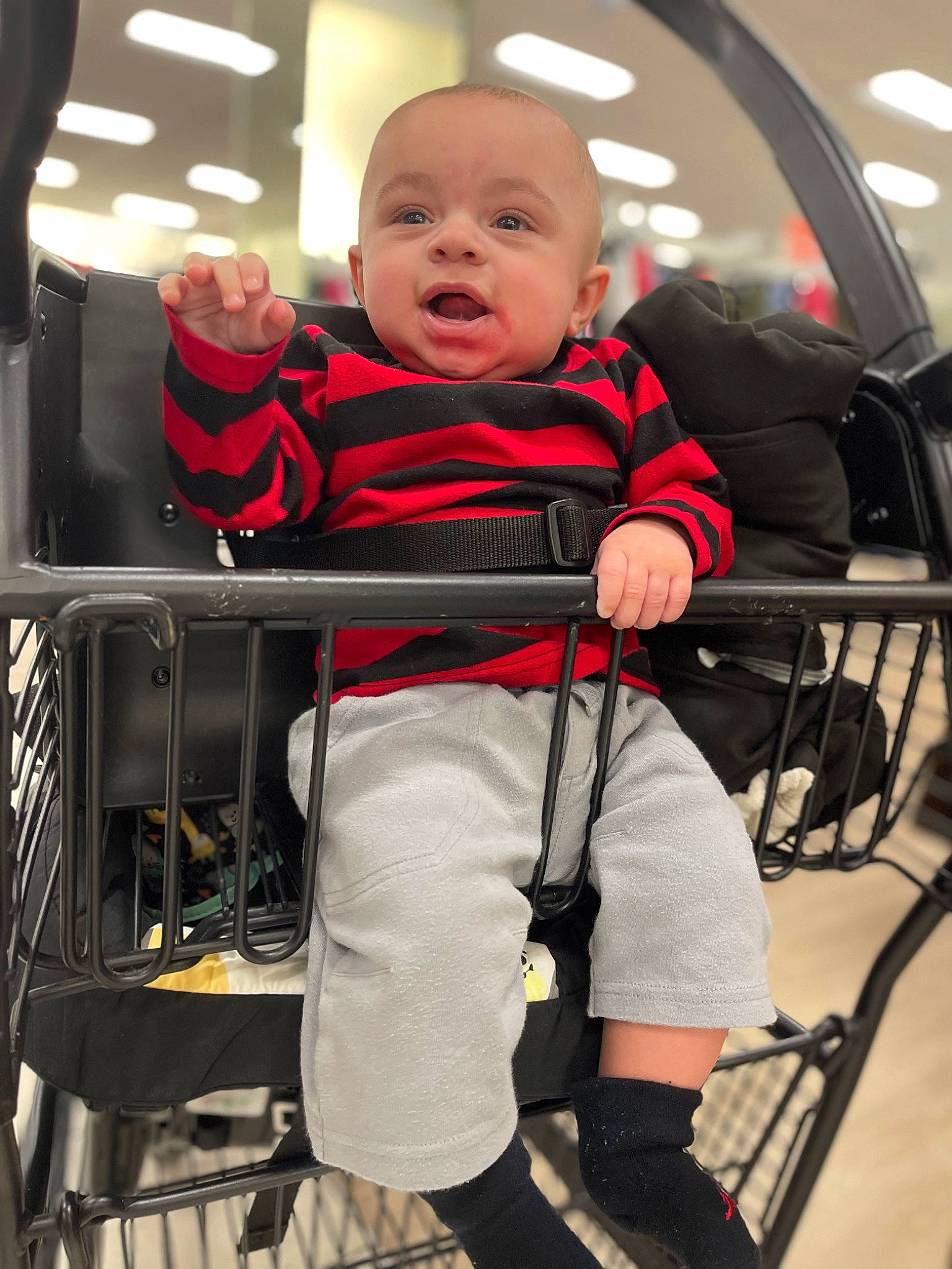 Kash is registered to the contest to win money with this photo: automotive_design, baby, baby_carriage, baby_products, baby_safety, baby_toddler_clothing, child, comfort, fun, human_leg, motor_vehicle, person, personal_protective_equipment, service, sitting, tire, toddler, wheel