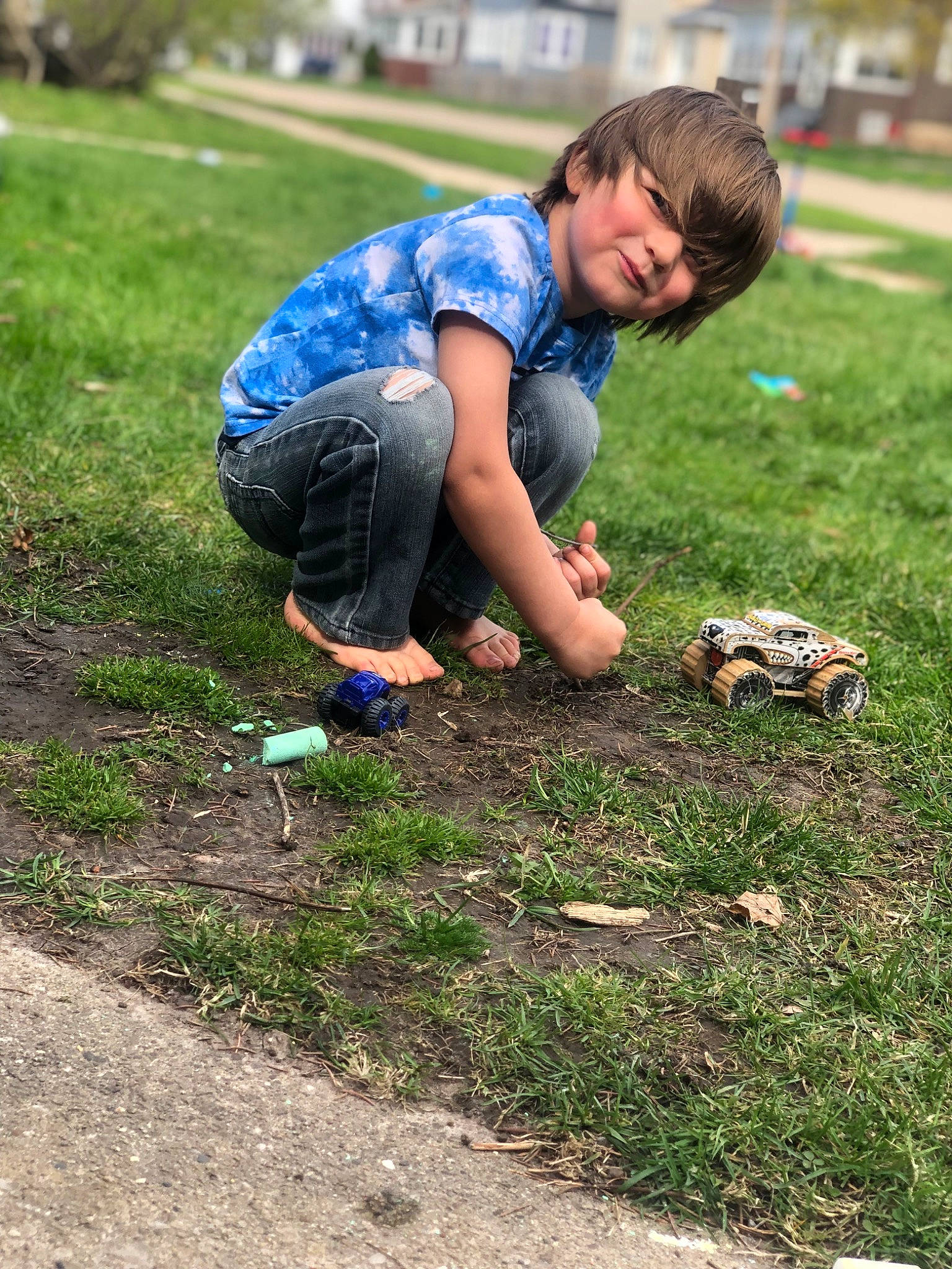 Soren is registered to the contest to win money with this photo: asphalt, child, competition_event, electric_blue, fun, grass, grassland, happy, joy, landscape, leisure, luggage_and_bags, people_in_nature, person, plant, recreation, shorts, smile, soil, t_shirt
