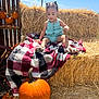 Nenase is registered to the contest to win money with this photo: autumn, blanket, blue_sky, child, crate, cute, fall, farm, green_clothing, hay_bale, nature, outdoor, plaid, portrait, pumpkin, sandals, seasonal, sunny, toddler, wood