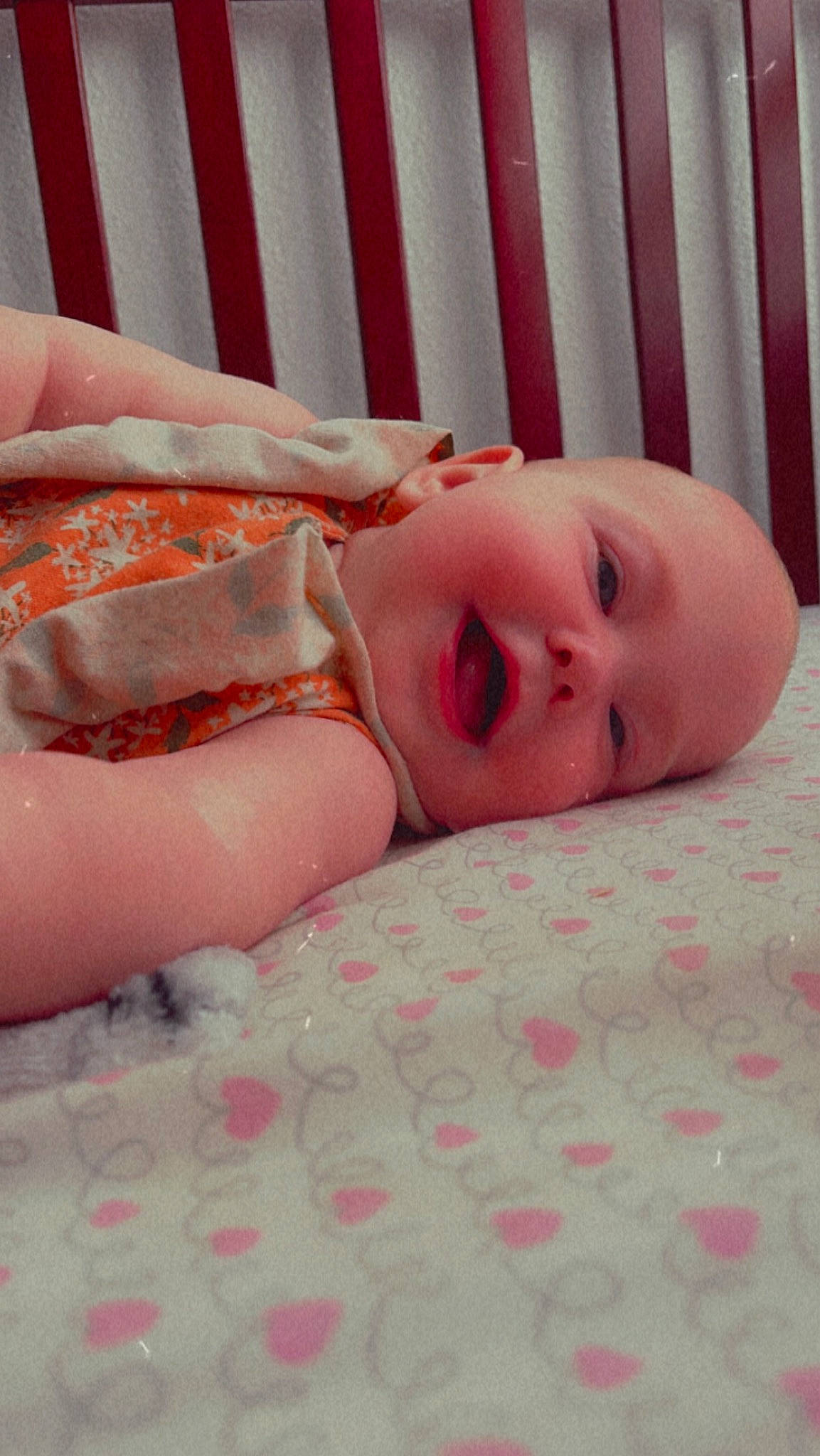 Davina is registered to the contest to win money with this photo: baby, baby_toddler_clothing, cheek, chin, comfort, eye, eyebrow, eyelash, finger, head, iris, linens, lip, mouth, nose, person, pink, skin, sleeve, textile