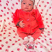 Aiyanna is registered to the contest to win money with this photo: baby, infant, child, headband, pink, coral, clothing, blanket, pattern, crown, socks, sitting, portrait, cute, indoor, soft, fabric, warm, expression, person
