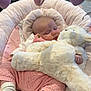 Lilly joined the competition — help win amazing prizes! baby, sleeping, stuffed_animal, pink_clothing, knitwear, socks, plush_toy, infant_seat, heart_shaped_toys, soft_toys, cozy, indoor, child, cute, cuddling, resting, pastel_colors, carpet, furniture, peaceful