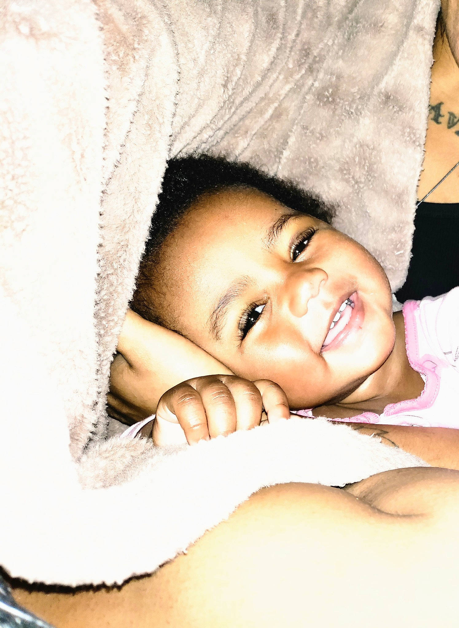 Sa'Diah is registered to the contest to win money with this photo: baby, cheek, chin, comfort, eyebrow, face, facial_expression, finger, flash_photography, gesture, happy, iris, lip, mouth, person, product, skin, sleeve, smile, textile