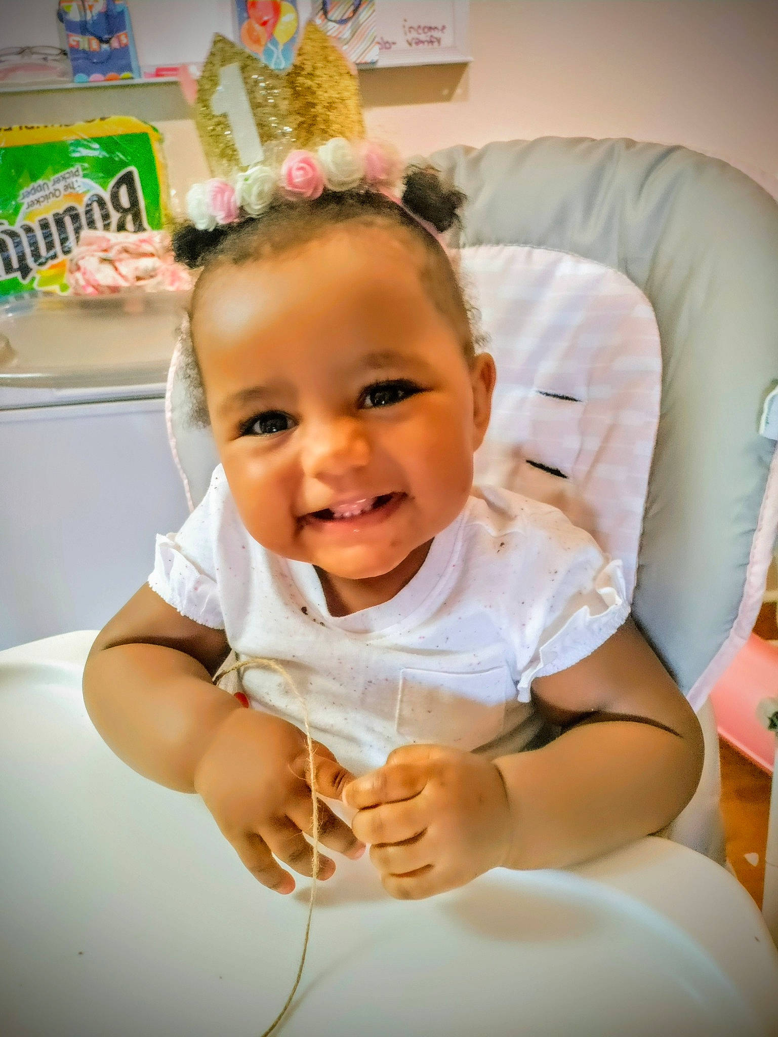 Sa'Diah is registered to the contest to win money with this photo: baby, baby_products, baby_toddler_clothing, chair, cheek, child, comfort, costume_hat, eyebrow, flooring, fun, gesture, happy, joy, party_supply, person, portrait_photography, room, sitting, smile