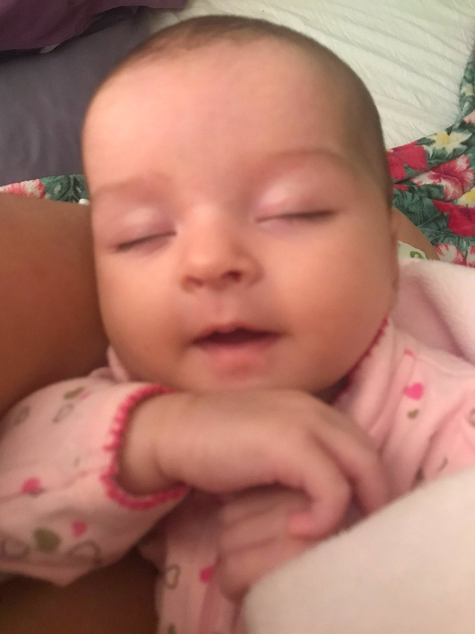 Chanel is registered to the contest to win money with this photo: arm, baby, baby_toddler_clothing, cheek, chin, comfort, eye, eyebrow, finger, gesture, head, iris, lip, mouth, nose, person, pink, skin, smile, textile